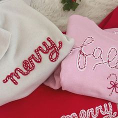 three personalized t - shirts with the word merry written in red, white and pink