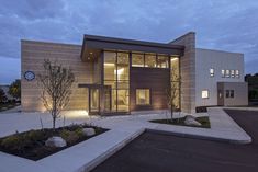 a large modern house lit up at night