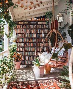 a room filled with lots of books and plants