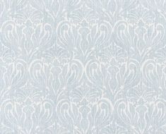 a blue and white wallpaper with an intricate design on the front, along with a ruler