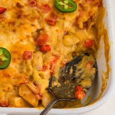 a casserole dish with green peppers and cheese