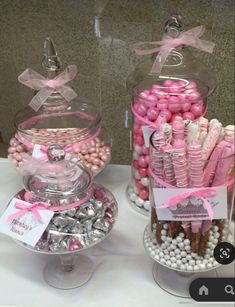 two glass containers filled with candy and candies