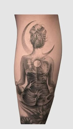 a woman with a tattoo on her leg is sitting in front of the sun and moon