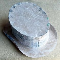 a white hat sitting on top of a table