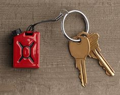 two keys attached to each other on a wooden surface