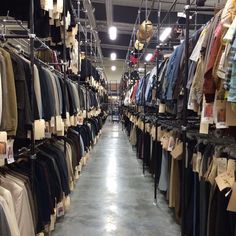 a store filled with lots of shirts and pants