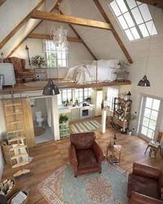 an aerial view of a living room and bedroom area in a loft with exposed beams