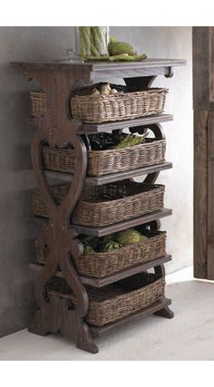 a wooden shelf with baskets on top of it