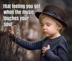 a little boy wearing a hat and holding on to a tree with the caption that reads, that feeling you get when the music touches your soul