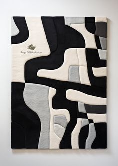 a black and white abstract painting on the wall