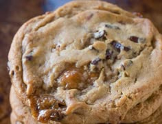 three chocolate chip cookies stacked on top of each other