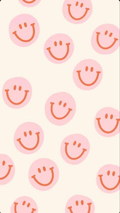 an orange and white background with many smiley faces on the bottom half of each face