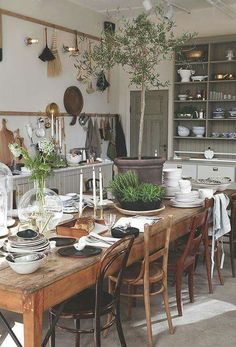 an image of a dining room table with plates and utensils on it's side