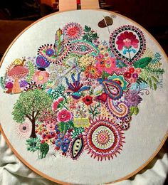 an embroidery project is being displayed on a table