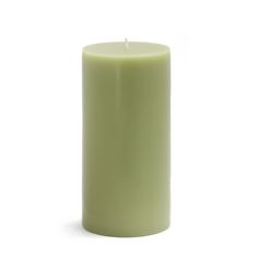 a green pillar candle on a white background