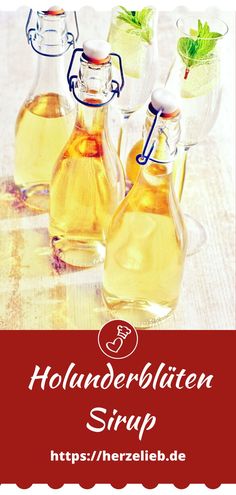 three bottles filled with liquid sitting on top of a table