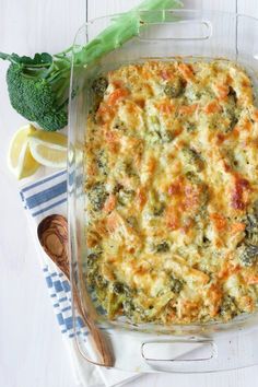 a casserole dish with broccoli and cheese in it on a table