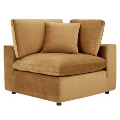 a brown couch with pillows on top of it