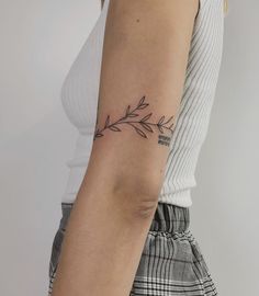 a woman with a small tattoo on her arm