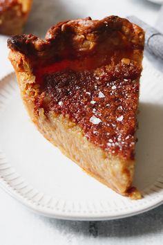 a piece of pie sitting on top of a white plate