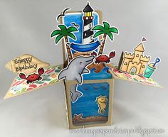 a card with an image of a dolphin in the ocean and a lighthouse on it