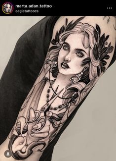 a woman's arm with an artistic tattoo design on the left side of her body