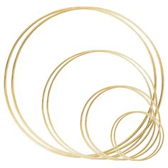 five gold colored metal rings on a white background