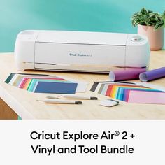 the cricut explore air 2 and vinyl and tool bundle is on a table