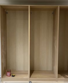 two empty wooden shelves in a room