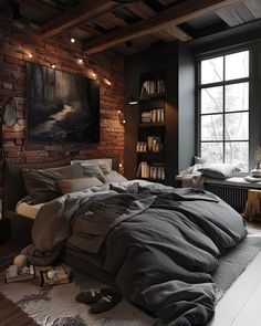 a bedroom with a brick wall and large windows