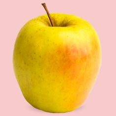 an apple is shown on a pink background