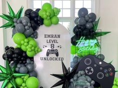 a video game themed birthday party with balloons and decorations