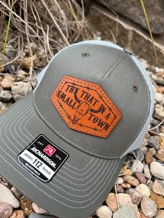 These leather patch Richardson 112FP hats are a great way to flaunt your style and look sleek at the same time. Patches made from 100% leather and engraved with a crisp design and hand stitched on our most popular style of hat. Your friends are going to be jealous! Multiple hat colors available, Bulk pricing available (see below) custom shape patches available upon request. SIZE OF PATCH HEIGHT WILL VARY DEPENDING ON CUSTOMER LOGO If a hat color is not listed please message us and we can order in a custom color if needed. Casual Leather Trucker Hat With Leather Patch, Casual Leather Trucker Hat With Patch, Casual Leather Hat With Leather Patch, Casual Leather Trucker Hat With Logo Patch, Leather Patch Hats, Casual Hats With Leather Patch - One Size, Laser Hat Patches, Leather Hat Patch, Leather Six-panel Trucker Hat With Leather Patch