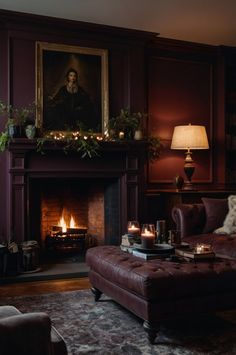 a living room filled with furniture and a fire place in front of a painting on the wall