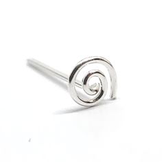 a silver ring with a spiral design on the front and back ends, sitting on a white surface