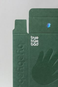 an open green box with a hand on the front and back cover that says bye bye bad