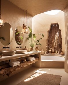 a bathroom with two sinks, mirrors and a bathtub in the middle of it