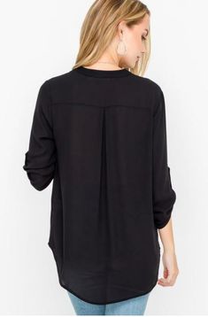 Final Sale - Get it before it's gone! The See That Girl Black Roll Tab Sleeve Top is ready for sunny days and walks in the park! This lightweight flowy tunic top top pairs a silky woven material with button-tab quarter sleeves, a split, deep V-neckline, and a rounded high-low hemline. DETAILS & CARE Polyester. Machine wash cold. Imported. Versatile Fall Blouse With Roll-up Sleeves, Relaxed Fit Rayon Tops For Fall, Flowy Rayon Casual Blouse, Casual Rayon Blouse For Layering, Versatile Black Rayon Tops, Fall Day Out Rayon Tops, Rayon Tops For Fall Day Out, Fall Rayon Tops For Day Out, Versatile 3/4 Sleeve Blouse For Fall