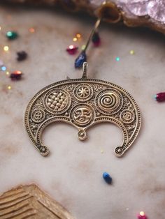 Adorn yourself with the mystical charm of our bronze crescent necklace, featuring a large Lunula moon symbol. This handcrafted Slavic amulet is intricately designed with unique patterns, embodying the rich heritage of Slavic pagan traditions. Perfect for those who appreciate historical and spiritual jewelry, this piece serves as a powerful talisman and a beautiful accessory. Made with high-quality bronze, it is both durable and enchanting, making it an ideal addition to any jewelry collection. Pagan Traditions, Slavic Paganism, Moon Symbol, Moon Symbols, Crescent Necklace, Pagan Jewelry, Spiritual Jewelry, Unique Patterns, Pendant Necklaces