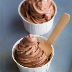 two white cups filled with chocolate ice cream