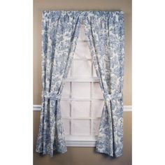 blue and white curtains hanging in front of a window with an open valance on the side