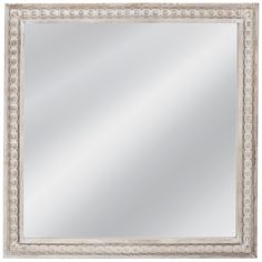 a white framed mirror with beading around the edges