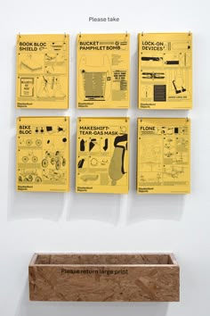 four pieces of art hanging on the wall above a wooden box with instructions for different types of tools