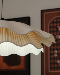 a light fixture hanging from the ceiling in a room