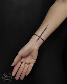 Black cross band tattoo on the wrist Cross Band Tattoo, The Wrist Tattoo, Tattoos On The Wrist, Tattoo On The Wrist, Cross Tattoo On Wrist, Cross Tattoos, Celtic Patterns, Band Tattoo, Black Cross