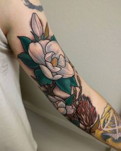 a person with a flower tattoo on their arm