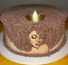 there is a cake that has been decorated to look like a woman's head