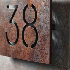 the number thirty three is engraved on a metal surface