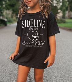 This SIDELINE SISTER SOCIAL CLUB Bella and Canvas shirt is perfect for all those game days ahead!  This tee is a trendy way to show your love for soccer season and your soccer sis' season of life.  Whether you are "here for the snacks" or ready to cheer on your favorite player from the sideline, this t-shirt is the perfect addition to your game day apparel! PLEASE READ THROUGH ALL OF THE FOLLOWING INFORMATION.  IF YOU HAVE FURTHER QUESTIONS, WE ARE HAPPY TO HELP! Welcome to CuratedClothCo.!  Her School Spirit Short Sleeve Shirt For Sports Season, Short Sleeve Shirt For Sports Season With School Spirit, Short Sleeve Shirt For School Spirit, Casual Tops For School Football Season, Casual School T-shirt For Football Season, Soccer Sister Shirt, Black T-shirt With Sublimation Print For School, Black Short Sleeve Shirt For Football Season, Soccer Sister