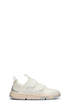 a white sneaker with two straps on the front and bottom part of the shoe